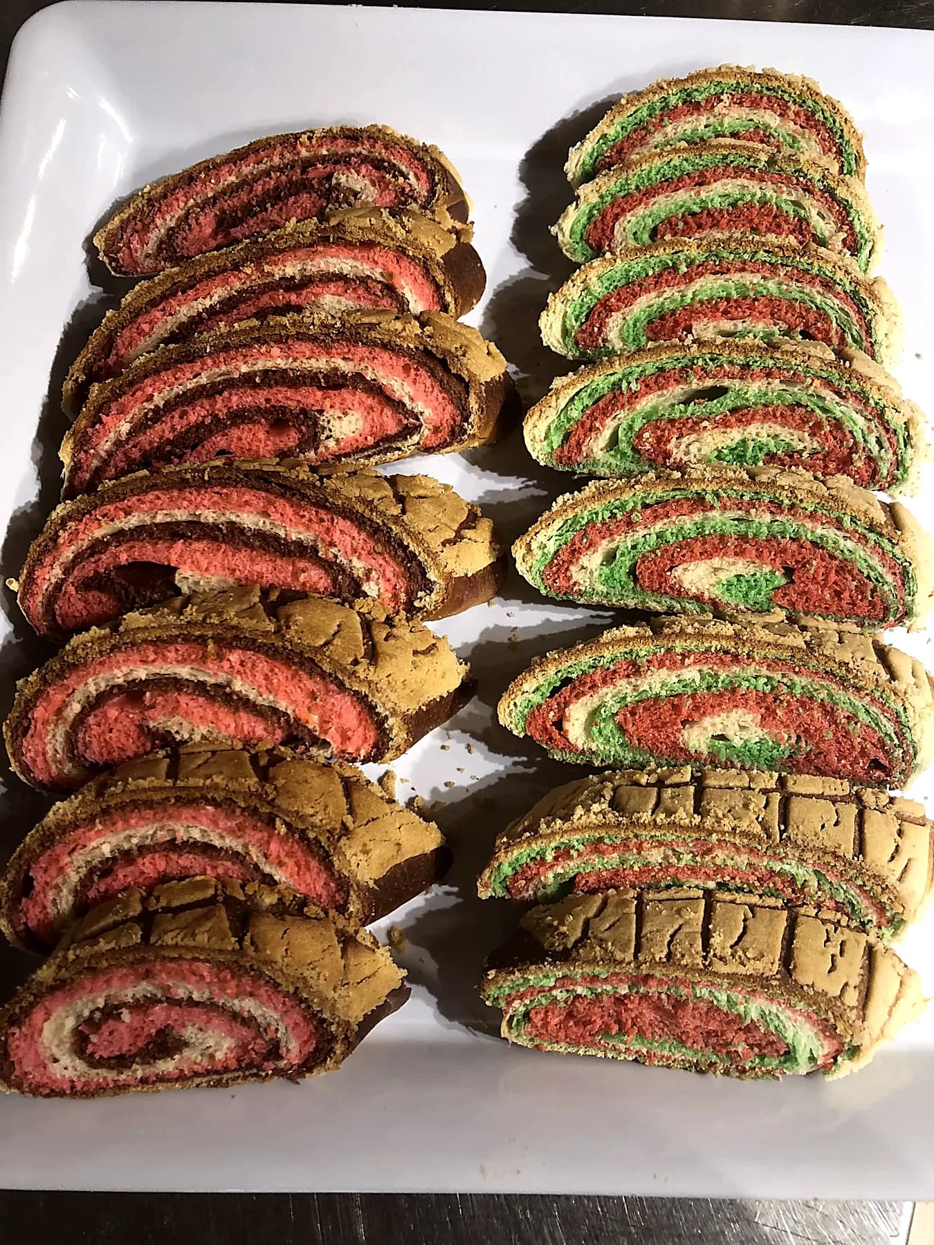 Trays of sliced pink and green festive sweet bread