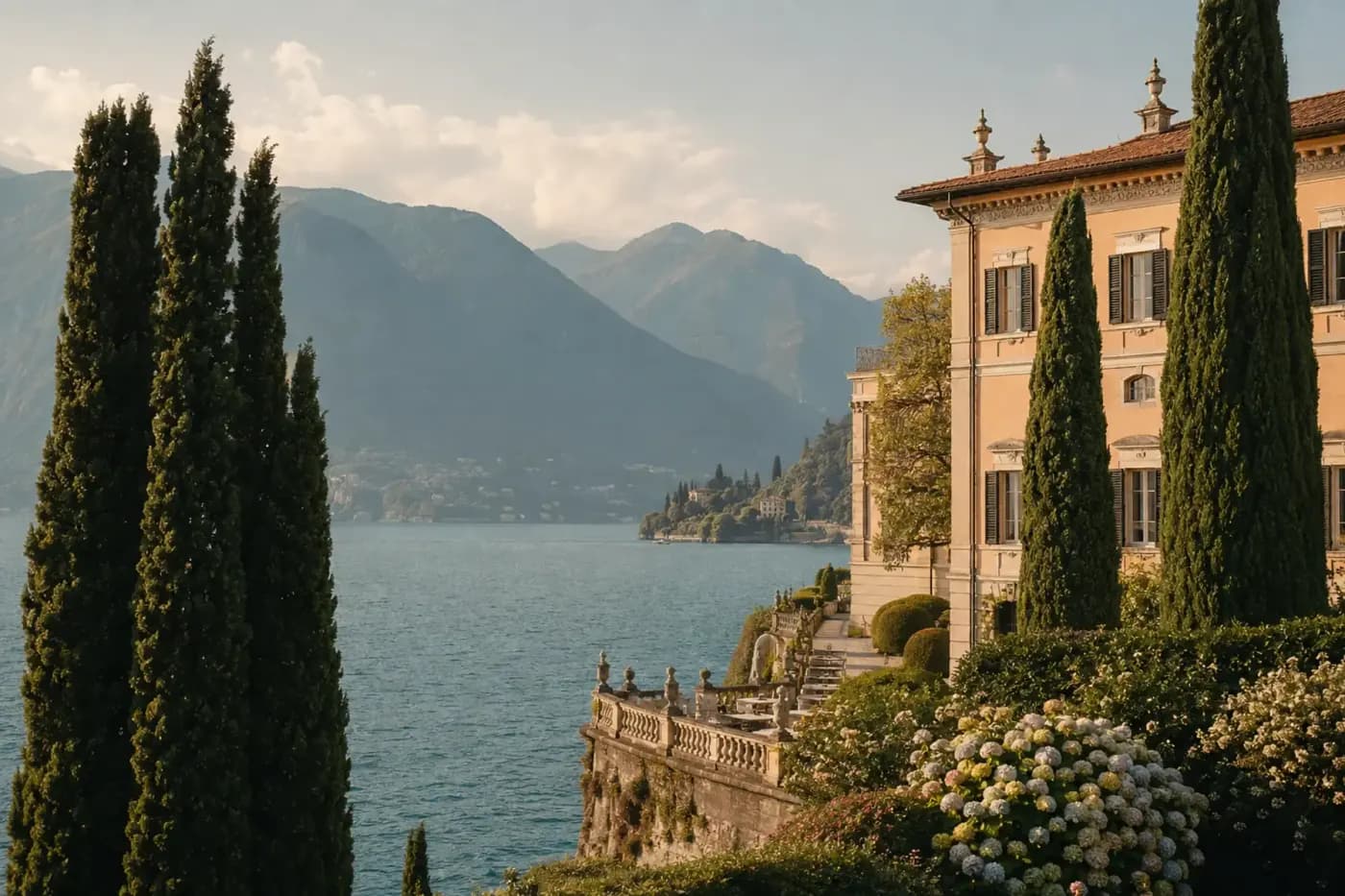 A lakeside villa among cypress trees above a mountain lake